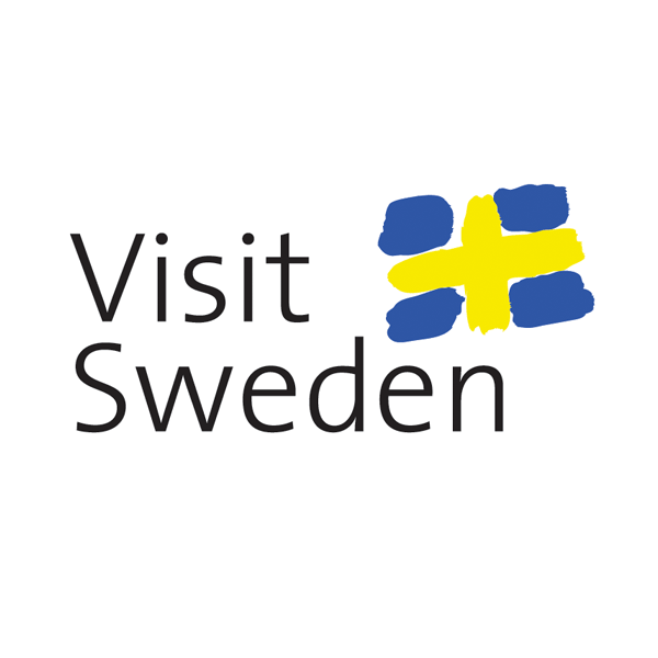 This is the official tourism logo for "Visit Sweden," featuring simple black text alongside a stylized Swedish flag design. The flag portion uses brush stroke-like shapes in the traditional Swedish colors of blue and yellow, creating a modern, artistic interpretation of Sweden's national flag.