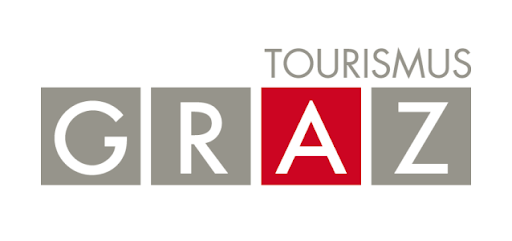 This is the logo for "Tourismus Graz," the tourism board of Graz, Austria. The design features the word "GRAZ" in bold letters with each letter in its own square block, where three blocks are gray and one block (the letter 'A') stands out in bright red, with "TOURISMUS" written in smaller gray text above.