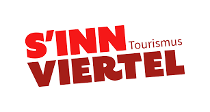 This image shows a bold red text logo that reads "S'INN VIERTEL" with "Tourismus" written in smaller text above "VIERTEL". The typography appears modern and dynamic with an angular, slanted design that gives it a sense of movement and energy.