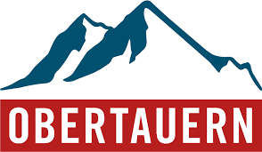 This is the logo for Obertauern, a ski resort and winter sports destination in Austria. The design features a stylized mountain silhouette in teal blue above bold red text spelling "OBERTAUERN" in capital letters.