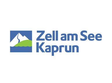 This is the logo for Zell am See-Kaprun, a tourist destination in Austria. The logo features a minimalist design with a white mountain silhouette against a blue background, with a green slope or hill beneath it, accompanied by the destination's name in blue text.